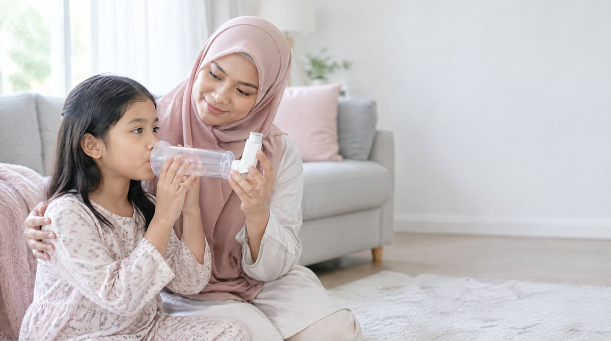 A mother helping her young daughter use an asthma inhaler with a spacer at home