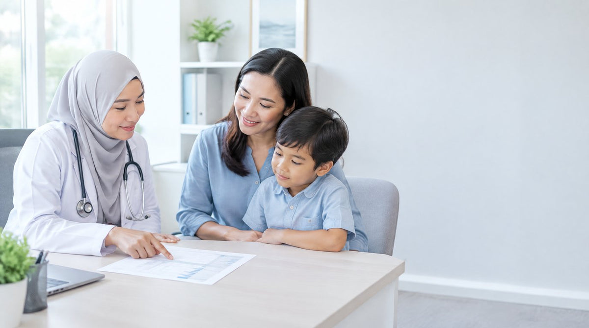 A doctor explaining a blood test report to a mother and her young son in a bright clinic