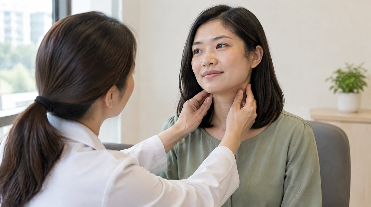 A female doctor gently checking the lymph glands on the side of a woman’s neck in a clinic